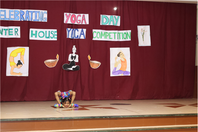 Celebrating International Yoga Day and Inter-House Yoga Competition Report