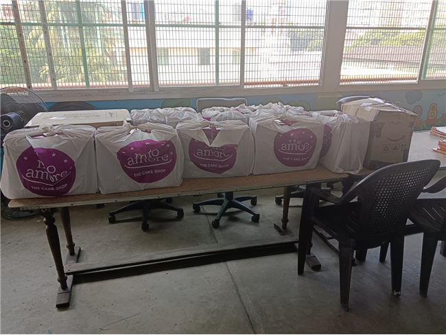Distribution of food packets to the students of the Loreto Literacy Centre