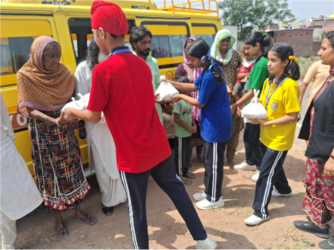 Wheat Flour Distribution by Students – Our Lady of Fatima Convent School, Assarpur